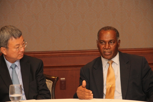 Deputy Managing Director of the International Monetary Fund Min Zhu and Premier of Nevis and Minister of Finance Hon Vance Amory at a meeting with stakeholders at the Four Seasons Resort on September 02, 2015